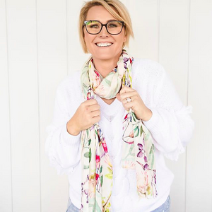 Smiling artist wearing Oatley Bay scarf around her neck