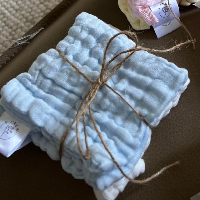 Blue cotton face cloth bundles with white and tied with string