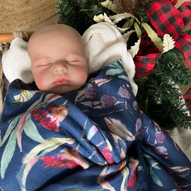 Baby wrapped in Christmas design baby swaddle
