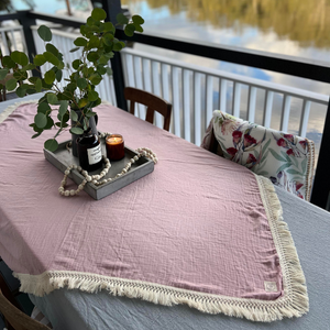 Dusty pink baby swaddle as table cloth centre piece