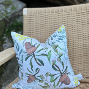 Cushion cover featuring hand painted designs of Australian bush flora wattle and banksia