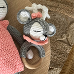 Load image into Gallery viewer, Hand knitted baby rattle in reindeer shape grey with white and pink trim
