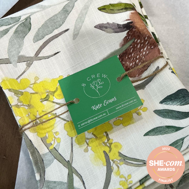 Linen and cotton tea towel wrapped up with 8crew logo design, She-com awards finalist
