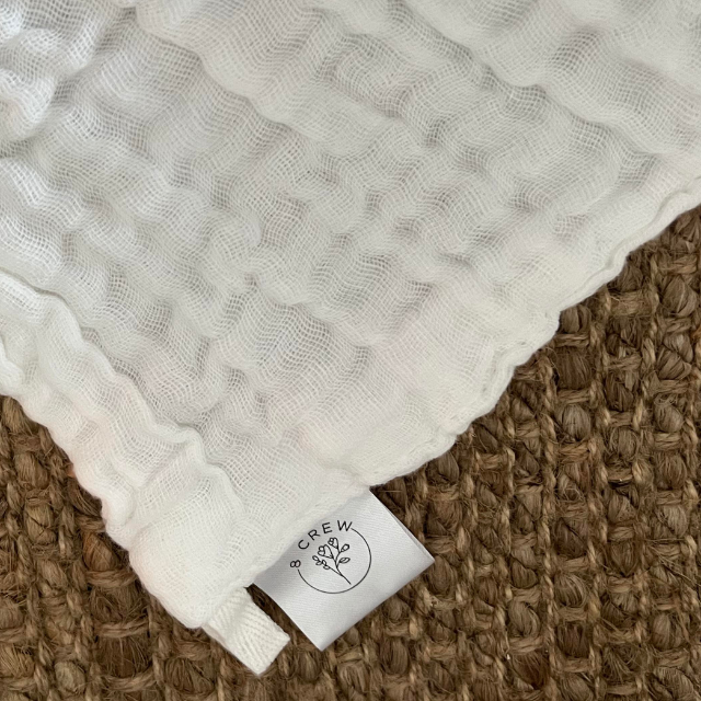 White cotton face cloth showing 8crew logo on the label